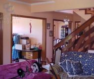 Casa com 450m², 4 dormitórios, 1 suíte, 6 vagas no bairro Santa Fé em Porto Alegre