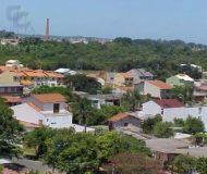 Casa com 450m², 4 dormitórios, 1 suíte, 6 vagas no bairro Santa Fé em Porto Alegre