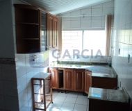 Casa com 363m², 3 dormitórios, 1 suíte, 2 vagas no bairro Partenon em Porto Alegre