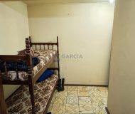 Casa com 450m², 3 dormitórios, 1 suíte, 6 vagas no bairro Jardim Lindóia em Porto Alegre