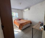 Casa com 99m², 2 dormitórios, 4 vagas no bairro Parque Minuano em Porto Alegre