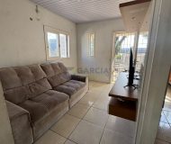 Casa com 99m², 2 dormitórios, 4 vagas no bairro Parque Minuano em Porto Alegre
