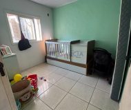 Casa com 99m², 2 dormitórios, 4 vagas no bairro Parque Minuano em Porto Alegre