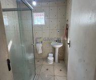 Casa com 99m², 2 dormitórios, 4 vagas no bairro Parque Minuano em Porto Alegre