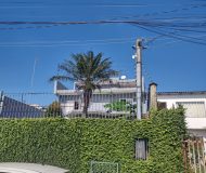 Casa com 400m², 3 dormitórios, 1 suíte, 2 vagas no bairro Costa e Silva em Porto Alegre