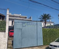 Casa com 400m², 3 dormitórios, 1 suíte, 2 vagas no bairro Costa e Silva em Porto Alegre