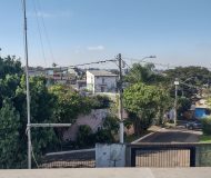 Casa com 400m², 3 dormitórios, 1 suíte, 2 vagas no bairro Costa e Silva em Porto Alegre