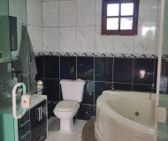 Casa com 400m², 3 dormitórios, 1 suíte, 2 vagas no bairro Costa e Silva em Porto Alegre