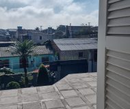 Casa com 400m², 3 dormitórios, 1 suíte, 2 vagas no bairro Costa e Silva em Porto Alegre