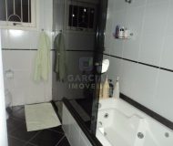 Casa com 286m², 4 dormitórios, 2 suítes, 2 vagas no bairro Santa Fé em Porto Alegre