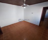 Casa com 270m², 6 dormitórios, 1 suíte, 3 vagas no bairro Sarandi em Porto Alegre