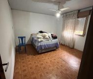 Casa com 80m², 2 dormitórios, 1 suíte, 2 vagas no bairro Santa Rosa de Lima em Porto Alegre