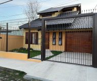 Casa com 212m², 3 dormitórios, 1 suíte, 3 vagas no bairro Rubem Berta em Porto Alegre