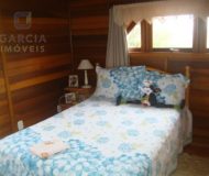 Casa com 172m², 3 dormitórios, 1 suíte, 3 vagas no bairro Jardim Itu Sabará em Porto Alegre