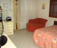 Casa com 390m², 4 dormitórios, 4 suítes, 6 vagas no bairro Jardim Planalto em Porto Alegre