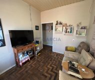 Casa com 58m², 2 dormitórios, 2 vagas no bairro Parque Minuano em Porto Alegre