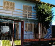 Casa com 160m², 3 dormitórios, 1 suíte, 2 vagas no bairro Sarandi em Porto Alegre