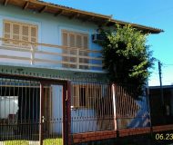 Casa com 160m², 3 dormitórios, 1 suíte, 2 vagas no bairro Sarandi em Porto Alegre