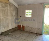 Casa com 346m², 4 dormitórios, 3 vagas no bairro Jardim Itu Sabará em Porto Alegre