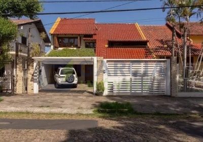 Casa com 350m², 4 dormitórios, 1 suíte, 3 vagas no bairro Jardim Itu em Porto Alegre