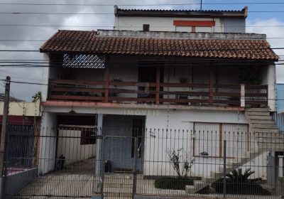 Casa com 400m², 5 dormitórios, 1 suíte, 2 vagas no bairro Sarandi em Porto Alegre