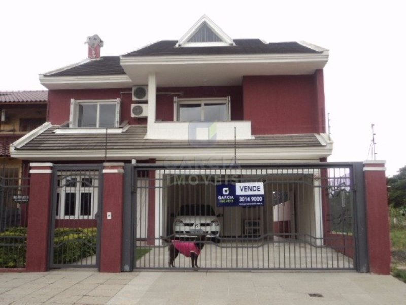 Casa com 286m², 4 dormitórios, 2 suítes, 2 vagas no bairro Santa Fé em Porto Alegre